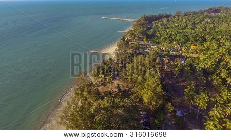Beautiful Coastal View Of Wide Tropical Beach With White Sand,coconut Trees And Azure Water On Pohon