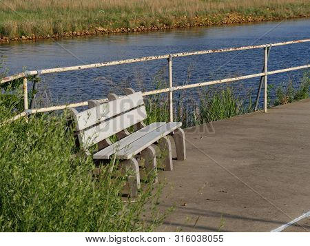 Bench At The Ramp At Lake Elmer Thomas, Wichita Mountain Wildlife Refuge, Oklahoma.