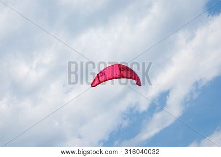 Lake Como, Italy - July 21, 2019. Kitesurfing Parachute Flies In The Sky