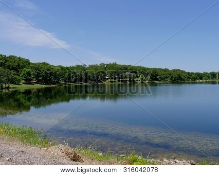 Breathtaking View Of A Lake At Chickasaw National Recreation Area In Davis, Oklahoma