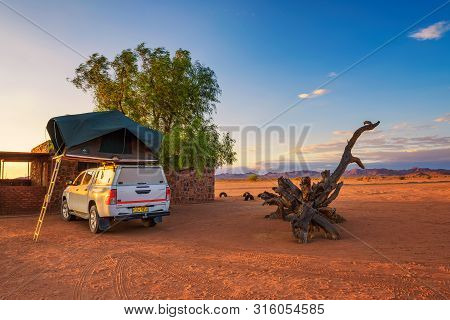 Betta, Namibia - March 27, 2019 : Tent Located On The Roof Of A Pickup 4x4 Car In A Desert Camp