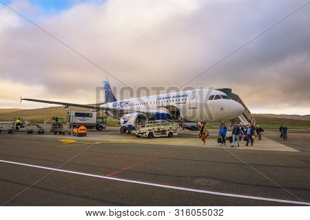 Vagar, Faroe Islands, Denmark - May 23, 2019 : Passengers Disembark From Airplane Of Atlantic Airway