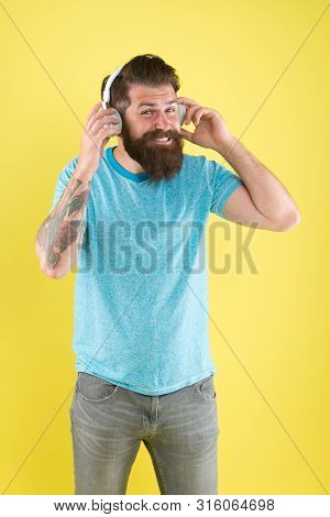 Freedom Going Wireless Offers You Is Unparalleled. Hipster Happy Using Modern Wireless Headphones. W