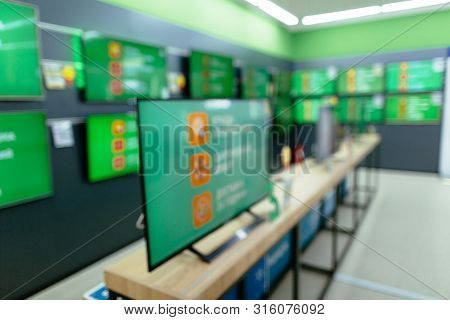 Plasma Tv In Electronics Store. Department Of Plasma Tv With Bokeh Blurred Background