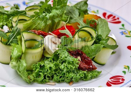 zucchini rolls with fresh salad