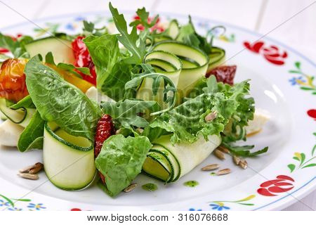 zucchini rolls with fresh salad