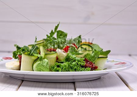 zucchini rolls with fresh salad
