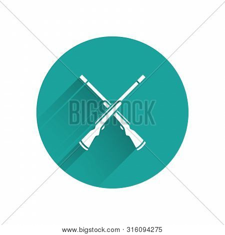 White Two Crossed Shotguns Icon Isolated With Long Shadow. Hunting Gun. Green Circle Button. Vector 