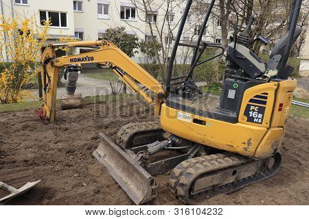 Muensingen, Switzerland- 15 4 2019: Excavator In Suburbian Area On Dirt