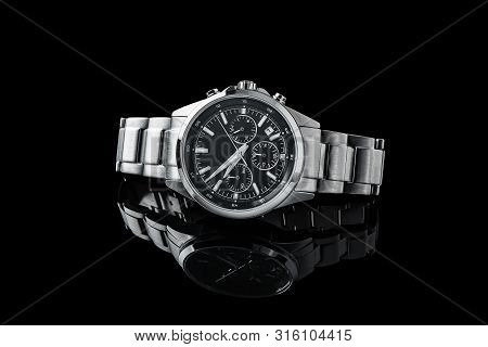 Luxury Wrist Watch. Brand. Japan Watch.
Luxury Watch Isolated On A Black Background With Reflection.