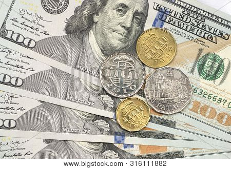 Pataca Coin On Top Of Dollar Bills For Financial And Investment Concepts