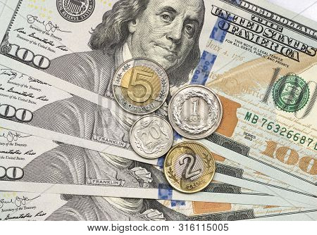 Polish Coin On Top Of Dollar Bills For Financial And Investment Concepts