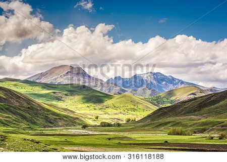 Mount Kose In Turkey Near Agri With Snow And Green Meadows