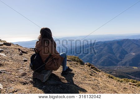 Beautiful Woman Sitting After Hiking During Winter Or Autumn In Catalonia (turo Del Home - Spain)