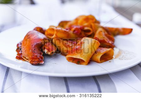 Pasta With Spiny Lobster And Tomato Sauce. Seafood Lunch At The Restaurant And A Glass Of White Wine