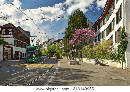 Basel, Switzerland - April 17, 2019. Green Tram On The Leonhardsgraben Street. Grossbasel District, 