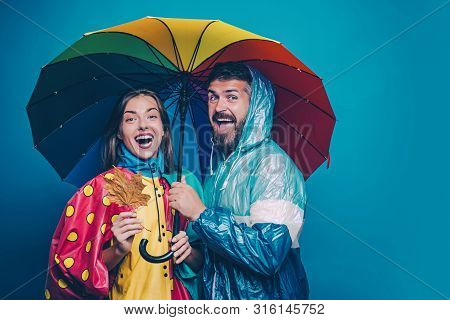 People In Rain. The Autumn Mood And The Weather Are Warm And Sunny And Rain Is Possible. Rain And Um