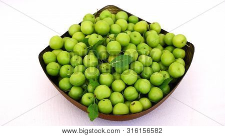 Green Plums, Fresh Plums, Sour Plums In A Container, Green And Sour Plums Close-up,
Lots Of Green An