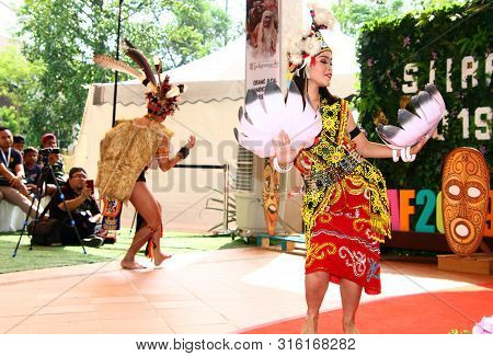 Selangor, Malaysia - August 04, 2019:   Iban Traditional Dance Performer From Sarawak Tribe During T