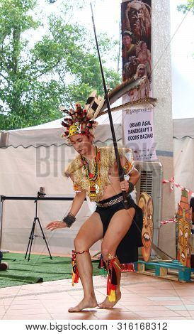 Selangor, Malaysia - August 04, 2019:   Iban Traditional Dance Performer From Sarawak Tribe During T