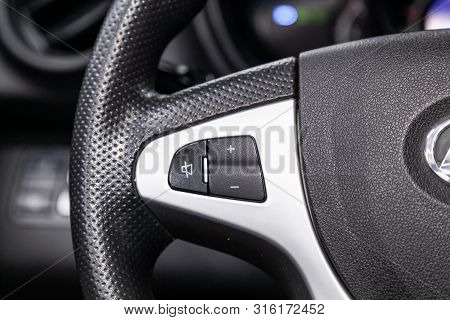 Novosibirsk, Russia - July 30, 2019: Lifan X60, Close-up Of The Multiwheel With Phone Setting And Vo