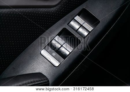 Novosibirsk, Russia - July 30, 2019: Lifan X60, Close-up Of The Side Door Buttons: Window Adjustment
