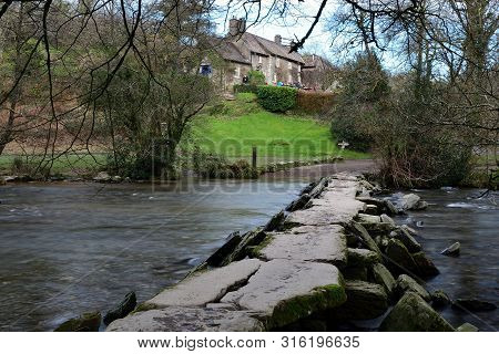 Photograph Of The Clapper  Bridge At Tarr Steps In Devon
