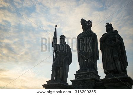 Statues Of Saints Norbert, Wenceslaus And Sigismund On Charles Bridge In Prague, Czech Republic. Med