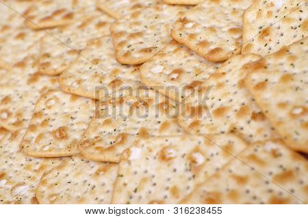Tuc Original Snack Crackers Lies On Market Table Stacked In Big Pile