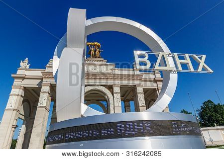 Moscow, Russia - July 22, 2019: Sign 80 Years Of Vdnh In Moscow Closeup Against Blue Sky And Arc Abo