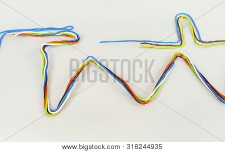 The Wires In The Insulation Are Colored Curved In Different Shapes On A Gray Background
