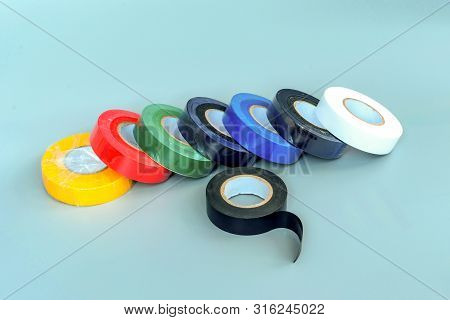 Set Of Multicolored Insulating Tapes On Gray Background