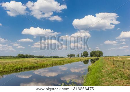 Littlle River Dwingelerstroom With Clouds Reflecting In The Water In Drenthe, Netherlands