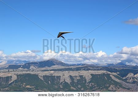 Hang Glider Flying On The Chabre Mountain, France