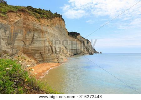 Corfu Beach Landscape - Island In Greece. Logas Beach Below The Cliffs.