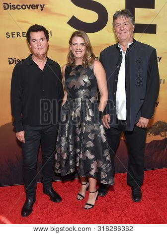 LOS ANGELES - JUL 23:  Simon Fuller, Nancy Daniels and John Downer arrives for the 'Serengeti' Special Screening on July 23, 2019 in Beverly Hills, CA                