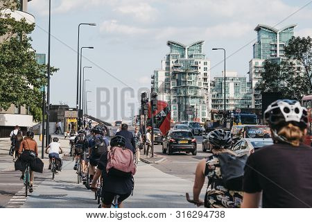London, Uk - July 16, 2019: Cyclists On Vauxhall Bridge In London, During Rush Hour, Selective Focus