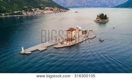 Aerial View Of Small Islands Of Ostrvo And Sveti Juraj Monastery In The Bay Of Kotor, Montenegro