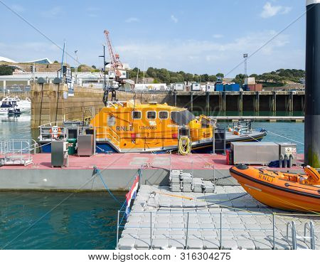 St Helier, Jersey, United Kingdom, - 07, 25, 2019: Life-boat Rescue Vessels Berthed In The Harbor