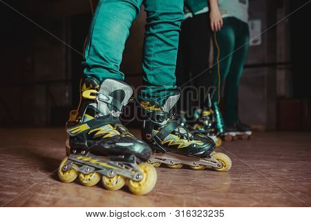 People Skating On Roller Rink. Roller Skating At Rollerdrome