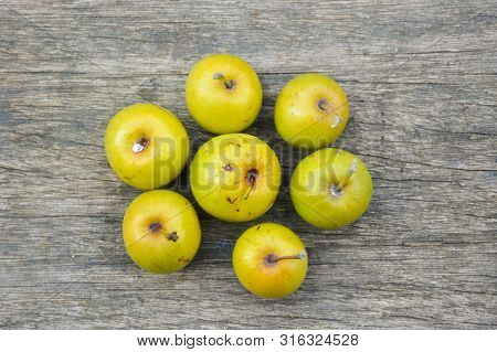 Close Up Fresh Jujube Fruit On Wood Plank