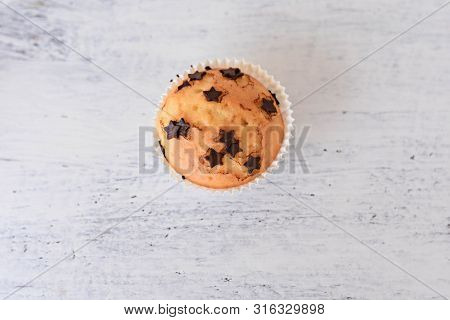Sweet Delicious Homemade Vanilla Muffins Whit Chocolate Chips At White Wooden Background
