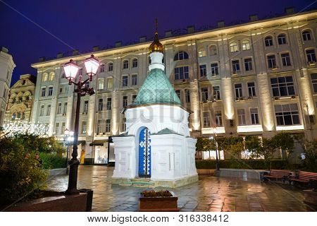 Moscow - July 2019: Orthodox chapel in Stoleshnikov Lane. Night view.