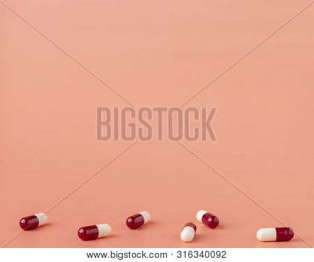Scattering Of Red And White Drug Capsules