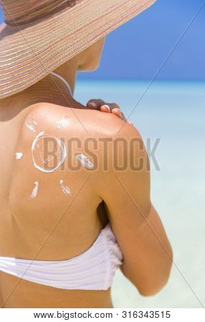 Sun Painted With Sunscreen On Shoulder To Make Aware About The Importance Of Protection When Going O