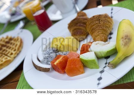 Breakfast With Tropical Fresh Fruit And Pancakes