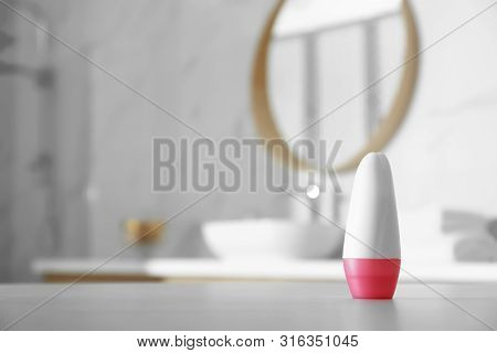 Deodorant Container On Table In Bathroom. Space For Text