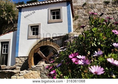Azenhas Do Mar, Sintra, Lisbon, Portugal- March 19, 2019: Beautiful And Colorful Waterwheel In Azenh