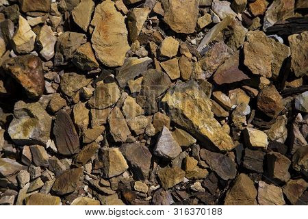 Background Of Stones In Rio Tinto, Spain.