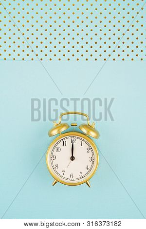 Flat Lay With Vintage Alarm Clock Over The Bastel Background